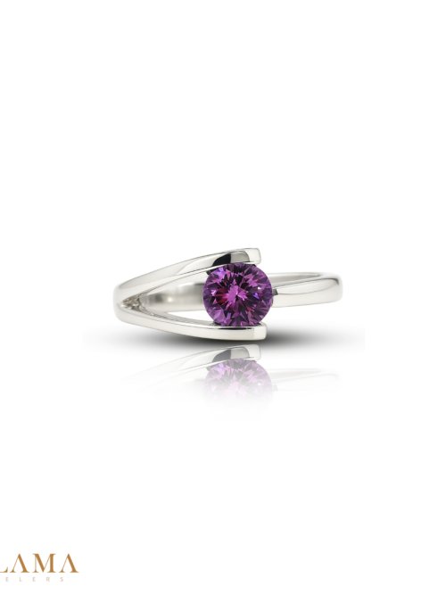 Crafted in sterling silver, this ring is set with a hand picked almandite garnet, glowing in deep purplish pink tones. Main Stone Almandite Garnet
