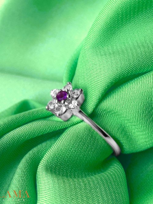 Crafted in sterling silver, this ring features a natural amethyst at its heart, embraced by six sparkling white topaz stones. Its rich purple hue exudes mystery and elegance. Main Stone Natural Amethyst Stone White Topaz