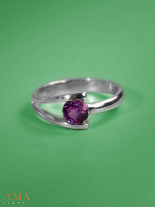 Crafted in sterling silver, this ring is set with a hand picked almandite garnet, glowing in deep purplish pink tones. Main Stone Almandite Garnet