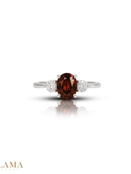 Crafted in sterling silver, this ring features a natural zircon with warm, earthy tones, framed by two sparkling American diamonds. Main Stone Natural Zircon Stone American Diamonds